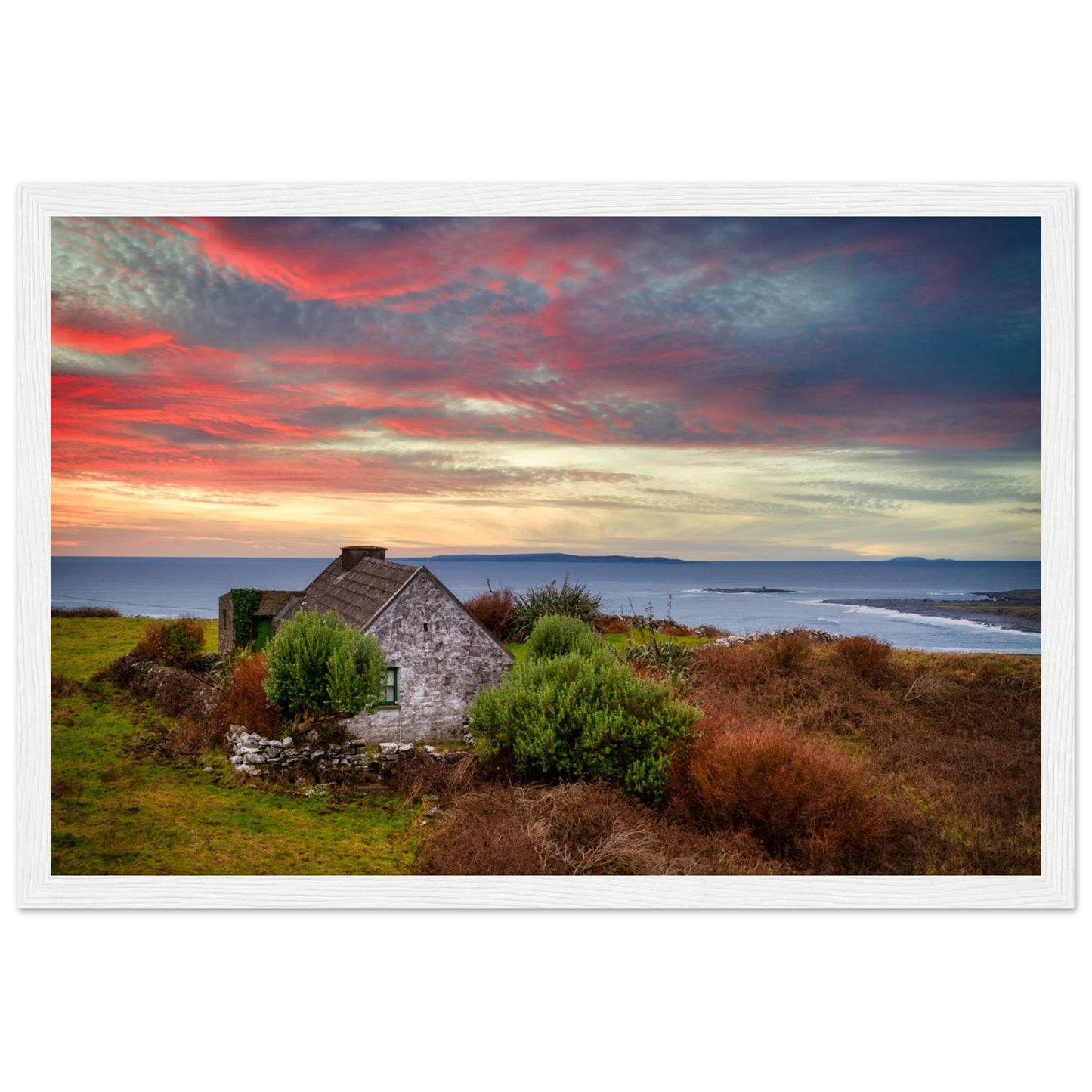 Art print capturing a serene sunset over the Atlantic Ocean in Doolin, Co. Clare, Ireland. A small cottage stands in the foreground, blending with the colorful sky reflecting on the water.