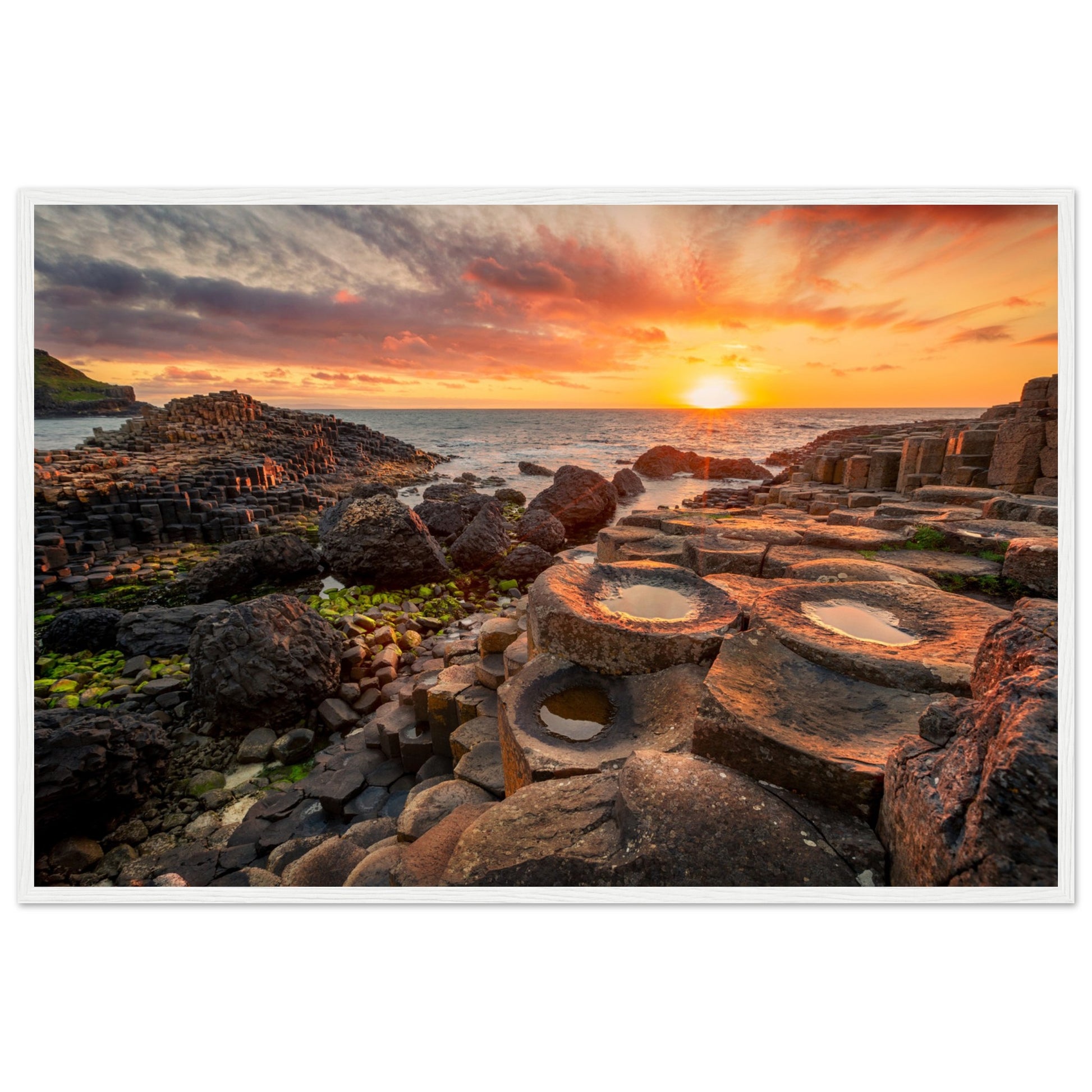 The iconic basalt columns set against the warm hues of the setting sun create a stunning visual masterpiece. Crafted with precision and attention to detail, this print brings the magic of this world-famous natural wonder into your space.