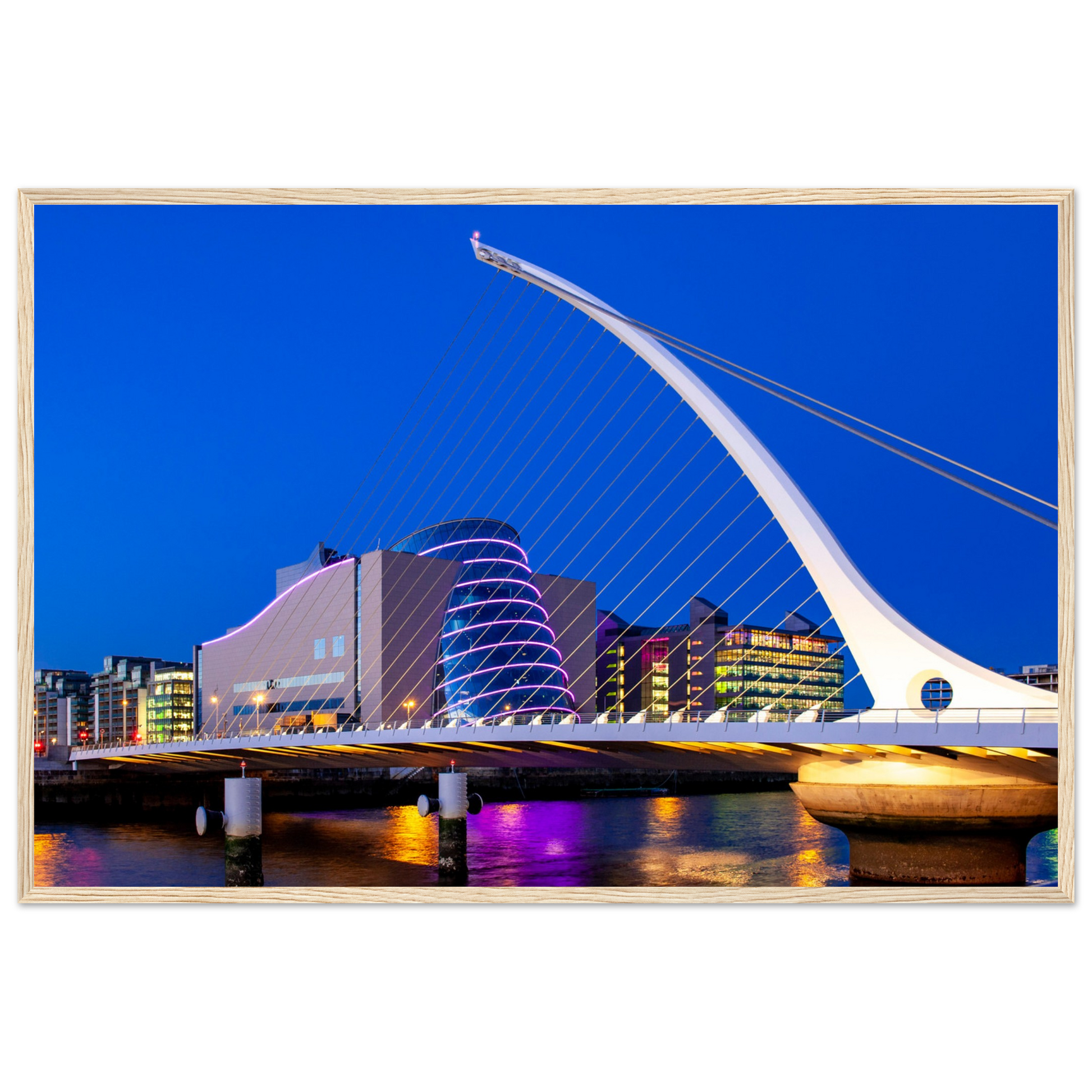 Enchanting Dublin skyline at night: Samuel Beckett Bridge & Convention Centre lights reflected on River Liffey. Framed art print captures city's magic.