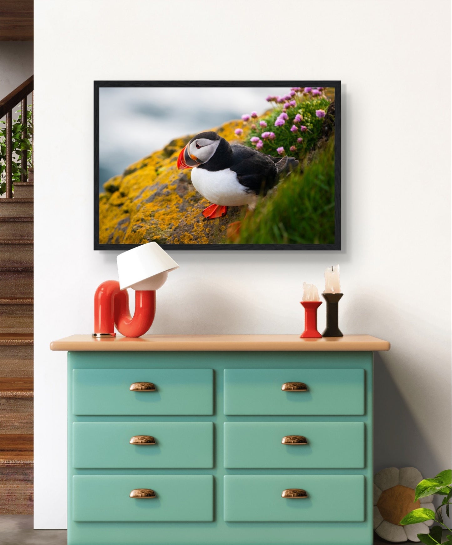 Vibrant puffin framed wall art print featuring the colorful bird against the coastal backdrop of Ireland, capturing nature's beauty and conservation message.