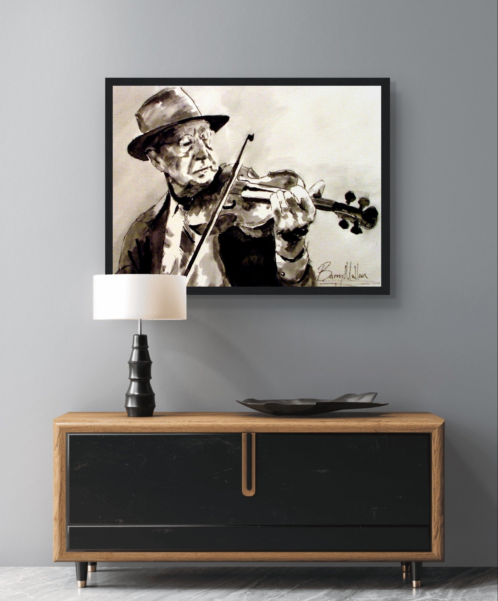 Framed art print of an Old Irish Traditional Fiddle Player by artist B. Mullan. Captures the essence of Irish music heritage with a black wooden frame. Perfect for music lovers and those appreciating Irish cultural traditions.