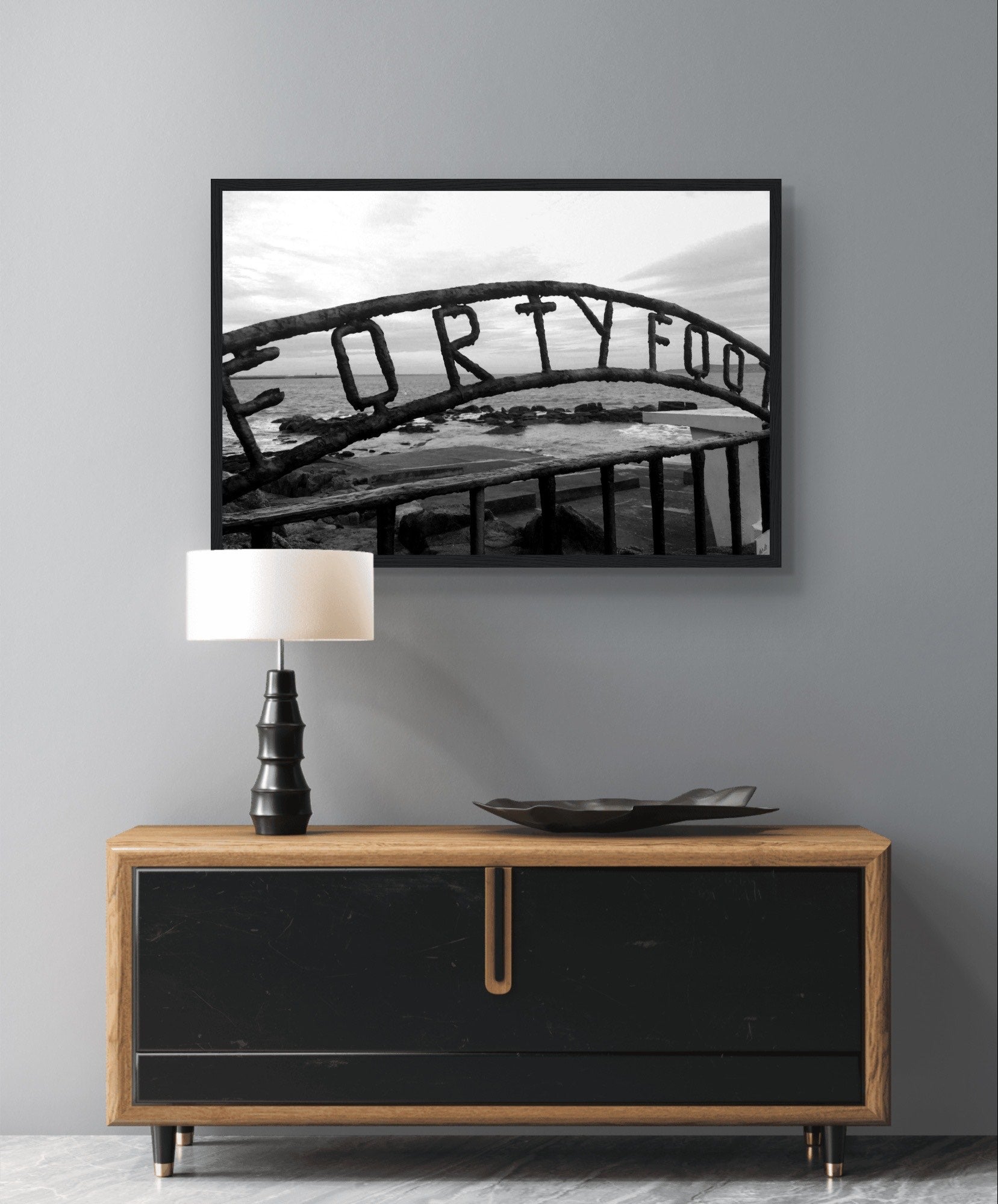 Vibrant coastal scene capturing the beauty of The Forty Foot in Dublin, featuring the iconic Martello tower and swimmers against a backdrop of serene waters.