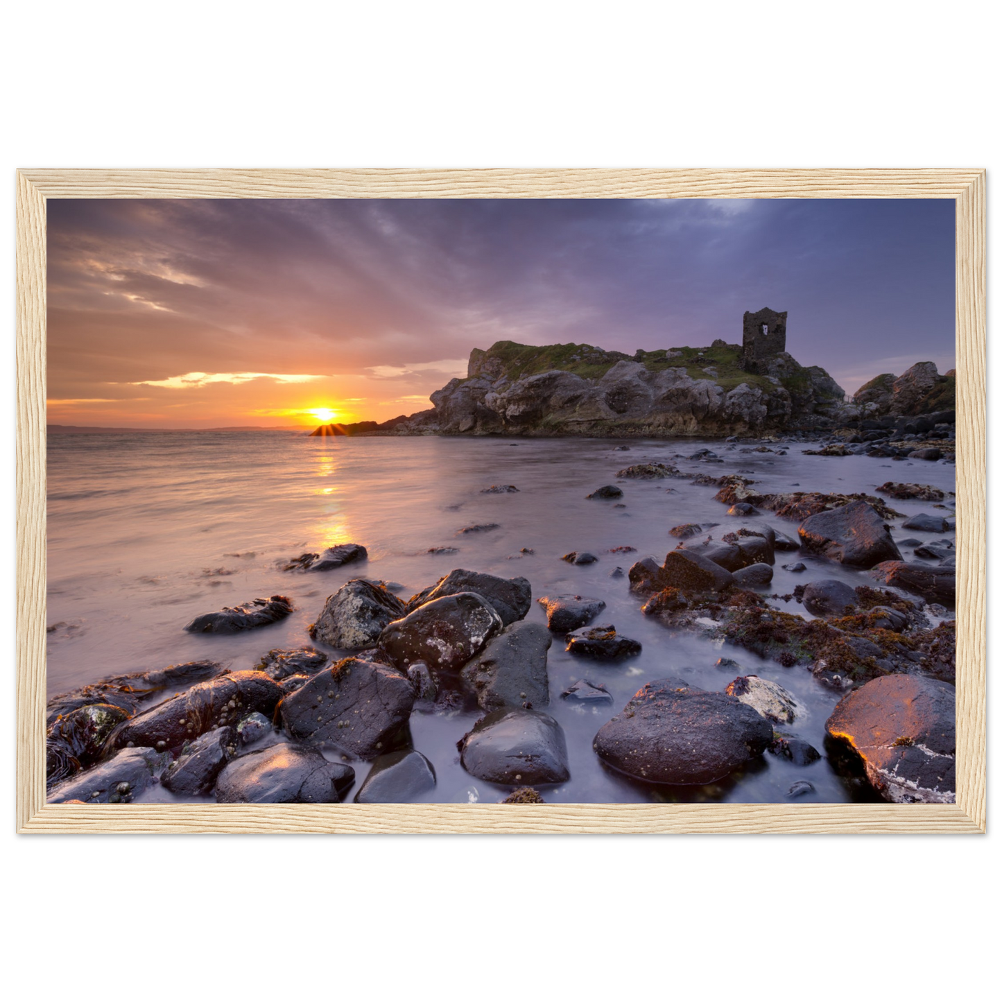 Framed wall art print of Kinbane Castle showcasing dramatic cliffside ruins above the North Atlantic waves. Perfect for adding a touch of Irish history and coastal charm to any space. Ideal for history lovers and those who appreciate Ireland's ancient beauty.