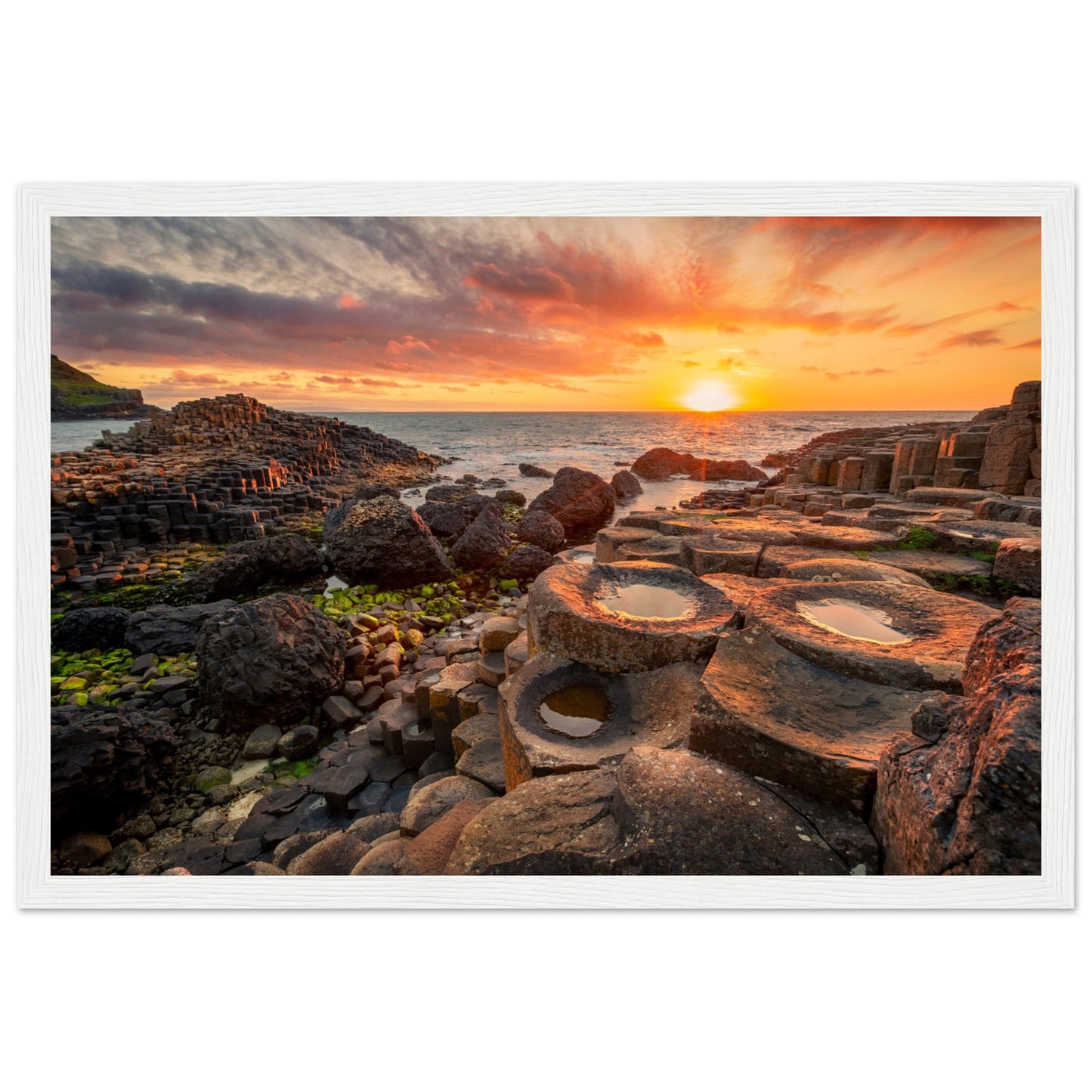 Capture the breathtaking beauty of nature with our framed art print featuring a mesmerising sunset at Giant's Causeway.