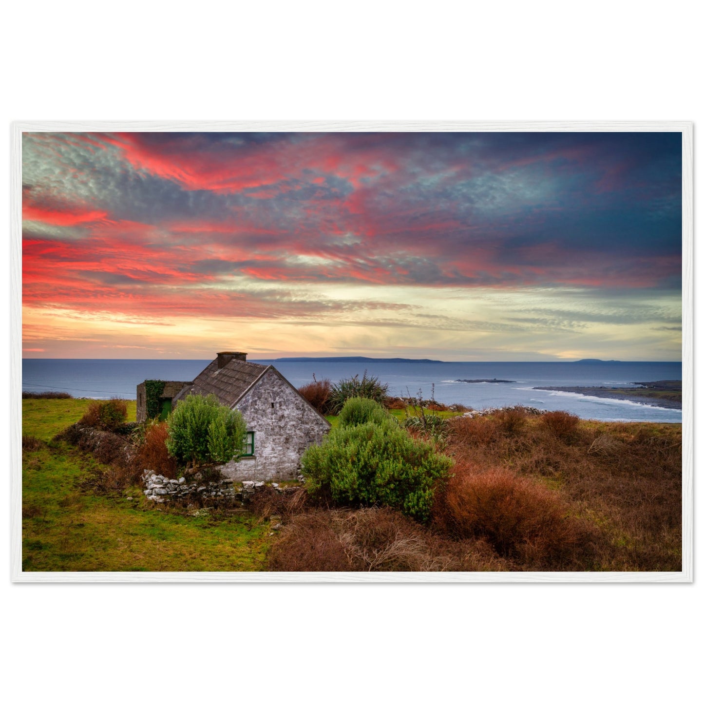 Art print capturing a serene sunset over the Atlantic Ocean in Doolin, Co. Clare, Ireland. A small cottage stands in the foreground, blending with the colorful sky reflecting on the water.